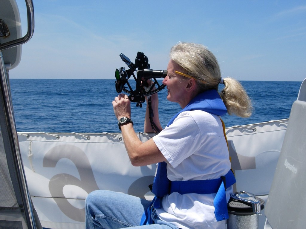 Gail Greenwald taking a sun shot during the 2005 Marion Bermuda Cruising Yacht Race  aboard the Valiant 42 Cordelia that she and her husband Roy sailed to 1st place in the Celestial Division, 1st in their class and third overall. This was her first experience as navigator in the race.  © SpectrumPhoto/Fran Grenon